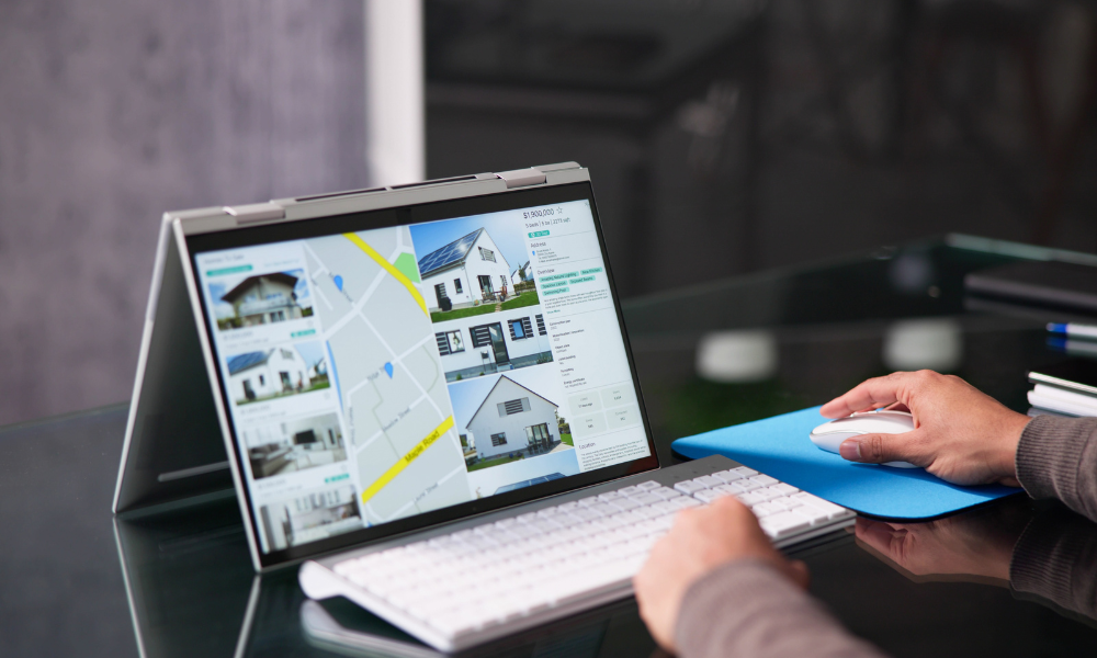 Investor researching property listings and maps on laptop for real estate opportunities